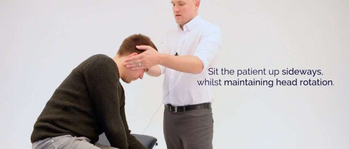 Sit the patient up whilst maintaining head rotation