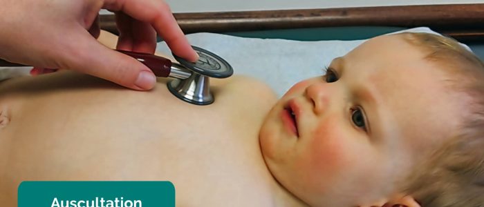 Auscultating the chest of a baby