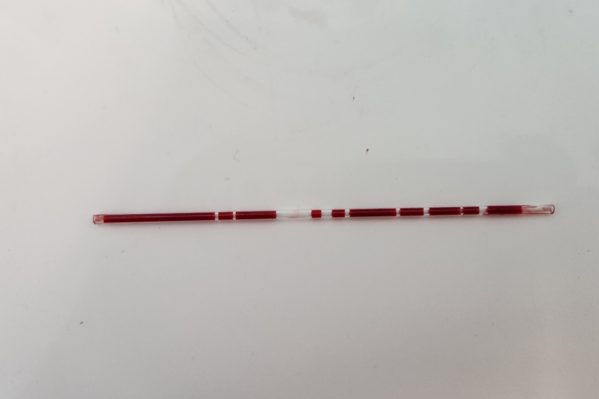 A capillary blood sample tube with air bubbles