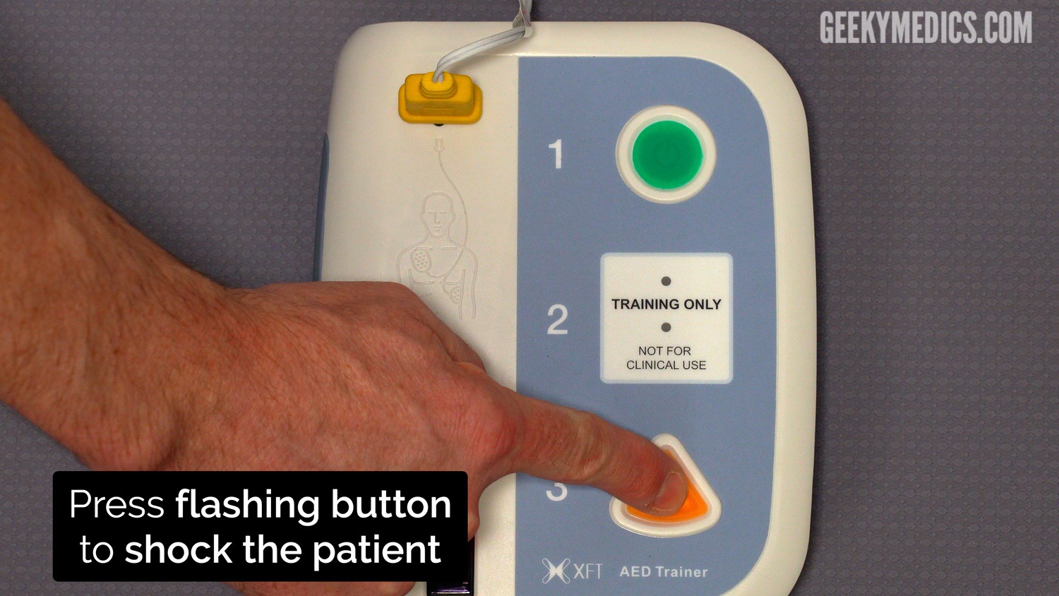 If a shock is required, after the AED has charged press the flashing button to deliver a shock