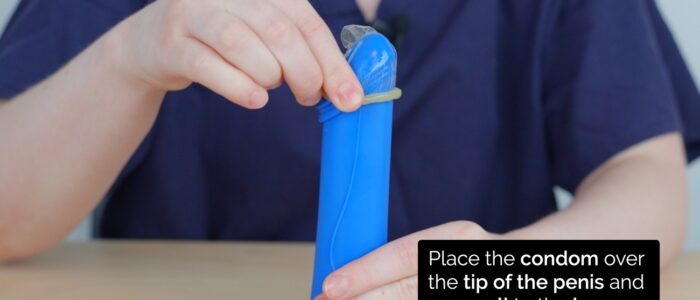 Condom counselling - Place the condom on the tip of the erect penis