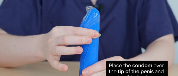 Condom counselling - roll it down the shaft using your other hand until it is fully unrolled